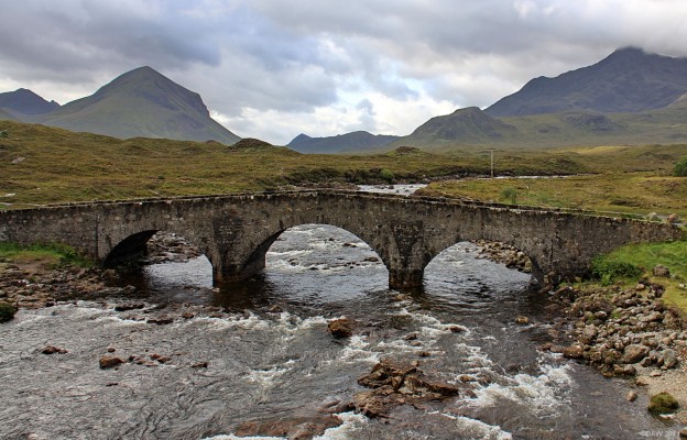 The old Sligachan bridge, Skye
You'll find this iconic view on Skye cropping up in lots of publications, so much so that Scottish Hydro made the decision to put power lines that run up the hill behind the bridge underground.  This photo was taken about a month before they started work in 2009, you can see one of the poles on the right.  [url=http://www.streetmap.co.uk/map.srf?X=148642&Y=829885&A=Y&Z=115/] Map location. [/url]
