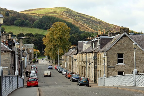 Looking along Thomas Telford Road, Langholm
An autumn view in Langholm with Meikleholm Hill in the background.  Thomas Telford was at Westerkirk a few miles outside Langholm, as an apprentice stonemason he worked on the bridge over the Esk this photo is taken from. [url=http://www.streetmap.co.uk/map.srf?X=336291&Y=584686&A=Y&Z=115/] Map location. [/url]
