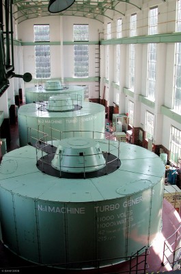 The turbine hall at Tongland Power Station, near Kirkudbright
This is the last in a chain 6 Power stations that make up the Galloway Hydros.  Tongland is the largest, capable of generating up to 33MW of power from the 106ft head of water at Tongland Dam.  The station is generally used in winter when the water levels in the rivers are high.  Tongland has a visitor centre that opens in the summer months with guided tours.
