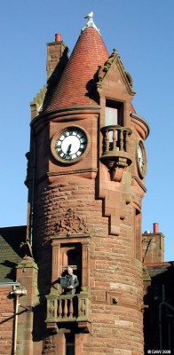 Barrhead Burgh Hall tower
Someone could do with cleaning the bird poo off the shoulders of the Town crier.  [url=http://www.streetmap.co.uk/streetmap.dll?G2M?X=250250&Y=658895&A=Y&Z=120/]Map location.[/url]
