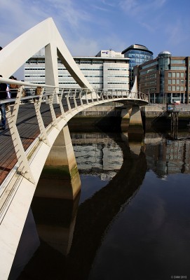 The tradeston footbride, Glasgow
Known in Glasgow as the squiggly bridge, due to its curve. It was given a curve to give greater length so that the incline isn't as steep as would have been required for a straight bridge, allegedly.  The bridge was opened in 2009 giving a link from the so called 'financial district' to Tradeston, I'm sure the good people of Tradeston feel all the better for it.
