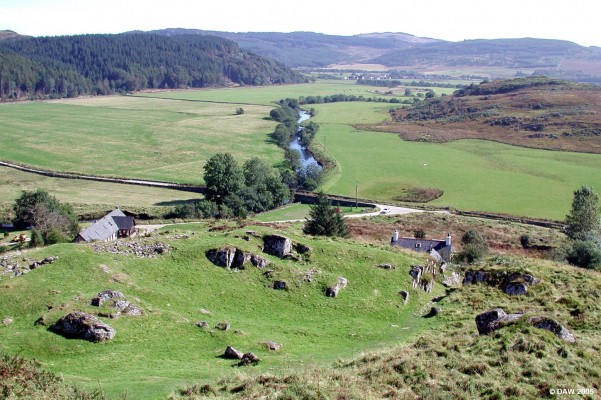View from top of Dunadd Hill Fort
Dunadd Fort lies on a natural flood plane with commanding views like this in all directions.  This is looking south east, the river Add can be seen snaking its way past the fort.  Lower down on the hill the outline of the fort wall can be seen with a break in the natural rock where the entrance is.
