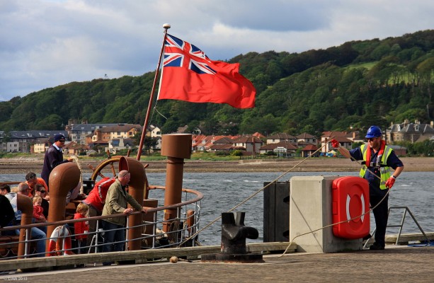 Paddle Steamer Waverley tying up at Largs pier
Note the helmet, life jacket, hi-viz jacket, gloves and no doubt safety shoes.  When I was a boy the rope catcher would have been equipped with a woolly jumper and maybe a cloth cap.
