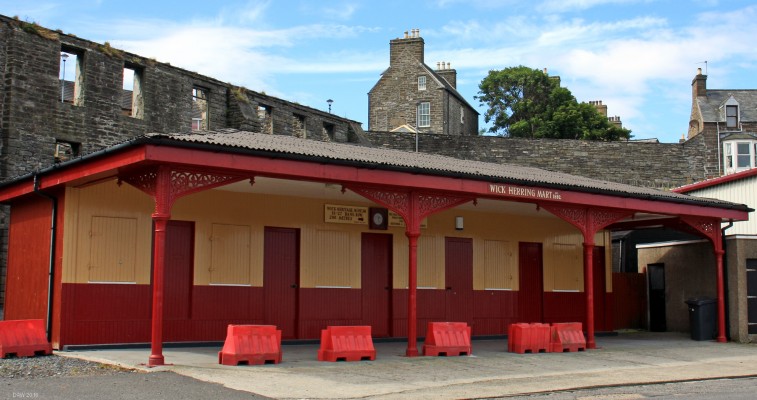 Wick Herring Mart, Wick Harbour
One of the restored historic buildings around Wick harbour.  It was built in 1892 to give shelter and office space to local fish salesmen.  It was the first of its type in the country and may be the last still in existence.  In the 2006 it was renovated by the Wick Society to its former glory.  [url=http://streetmap.co.uk/map.srf?X=336788&Y=950513&A=Y&Z=115/] Map location. [/url]
