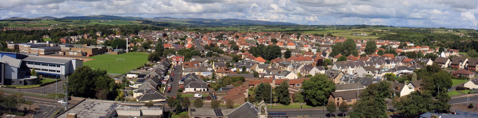Kilwinning, North Aurshire
A rooftop view looking west over Kilwinning from the top of the old Abbey Tower. [url=http://www.streetmap.co.uk/map.srf?X=230883&Y=643723&A=Y&Z=120&ax=230298&ay=643280/] Map location. [/url]
