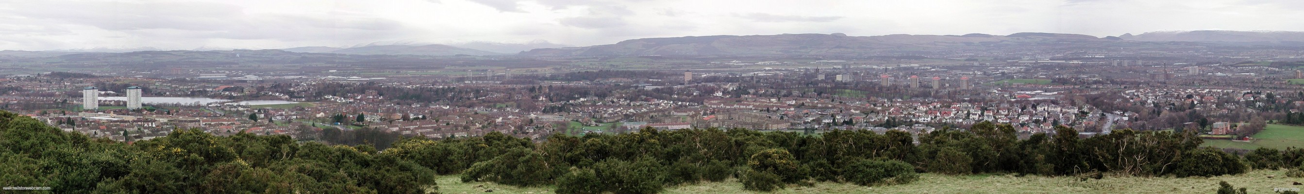 Over looking Paisley from the Brownside Braes, 2007
Taken on a cold January afternoon, you can see all the hills in the distance have a covering of snow.  On the extreme left is Stanley reservoir, the Glenburn area is in the centre and Thornly Park on the right hand side.  [url=http://www.streetmap.co.uk/map.srf?X=248020&Y=660445&A=Y&Z=120/] Map location. [/url]
